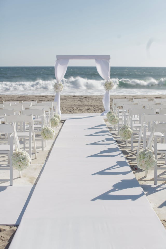 Featured photo from All White Everything Beach Wedding