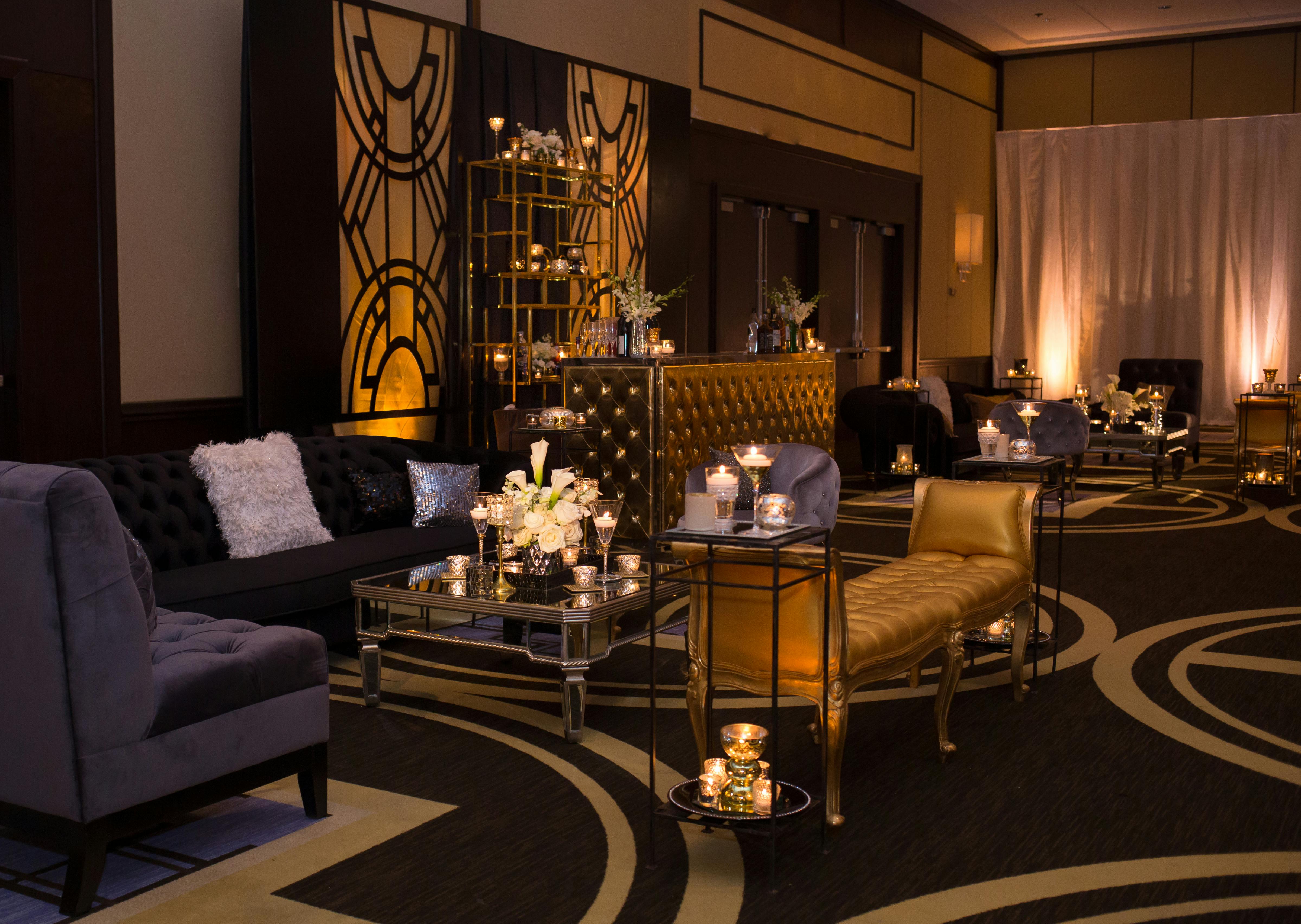 gold and black gatsby themed lounge area