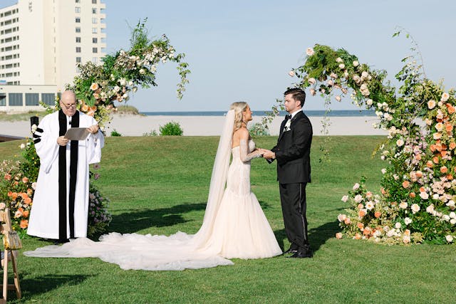 Featured photo from See This Oceanfront Wedding at The Dunes Golf and Beach Club with Lush Florals and Breezy Style