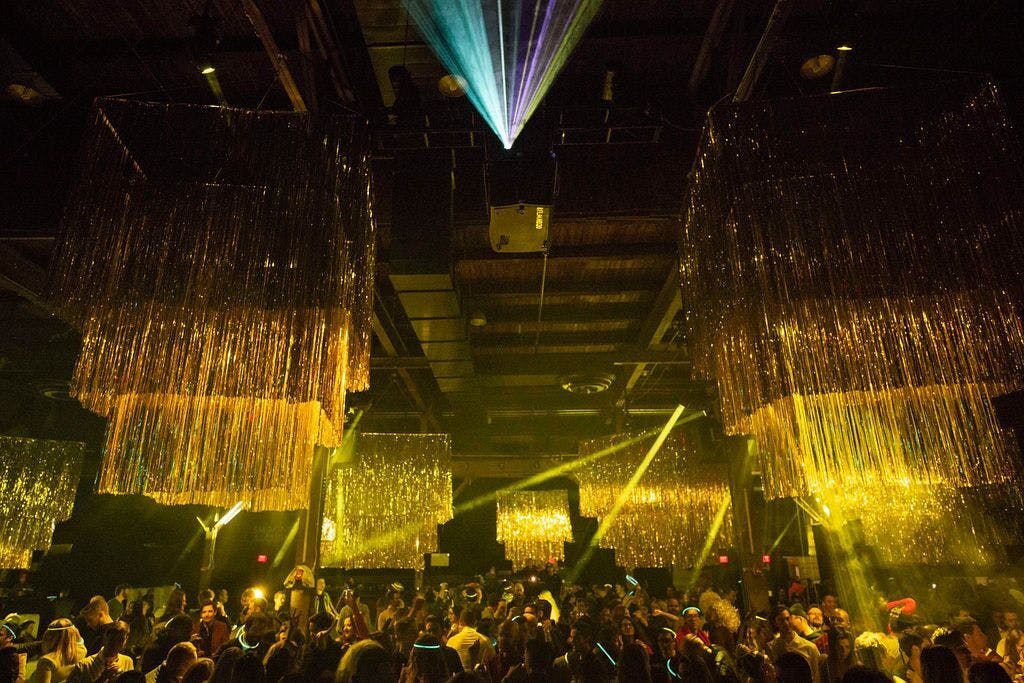 gold lighting over a crowd of people