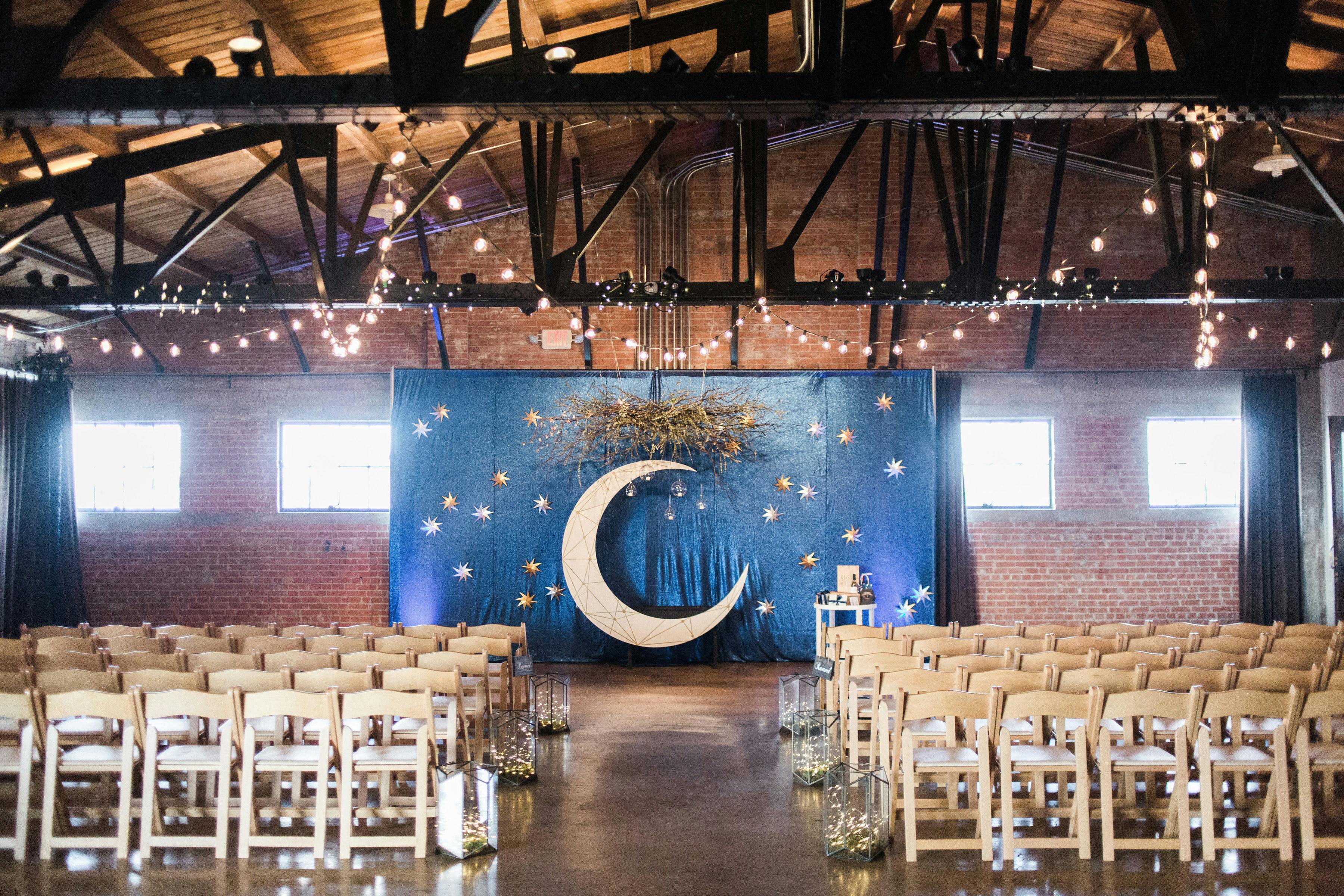 industrial chic warehouse with beamed ceiling and fairy lights. 