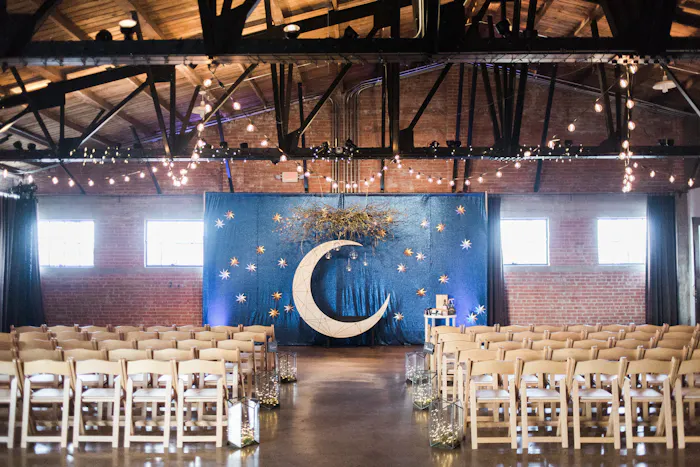 industrial chic warehouse with beamed ceiling and fairy lights.