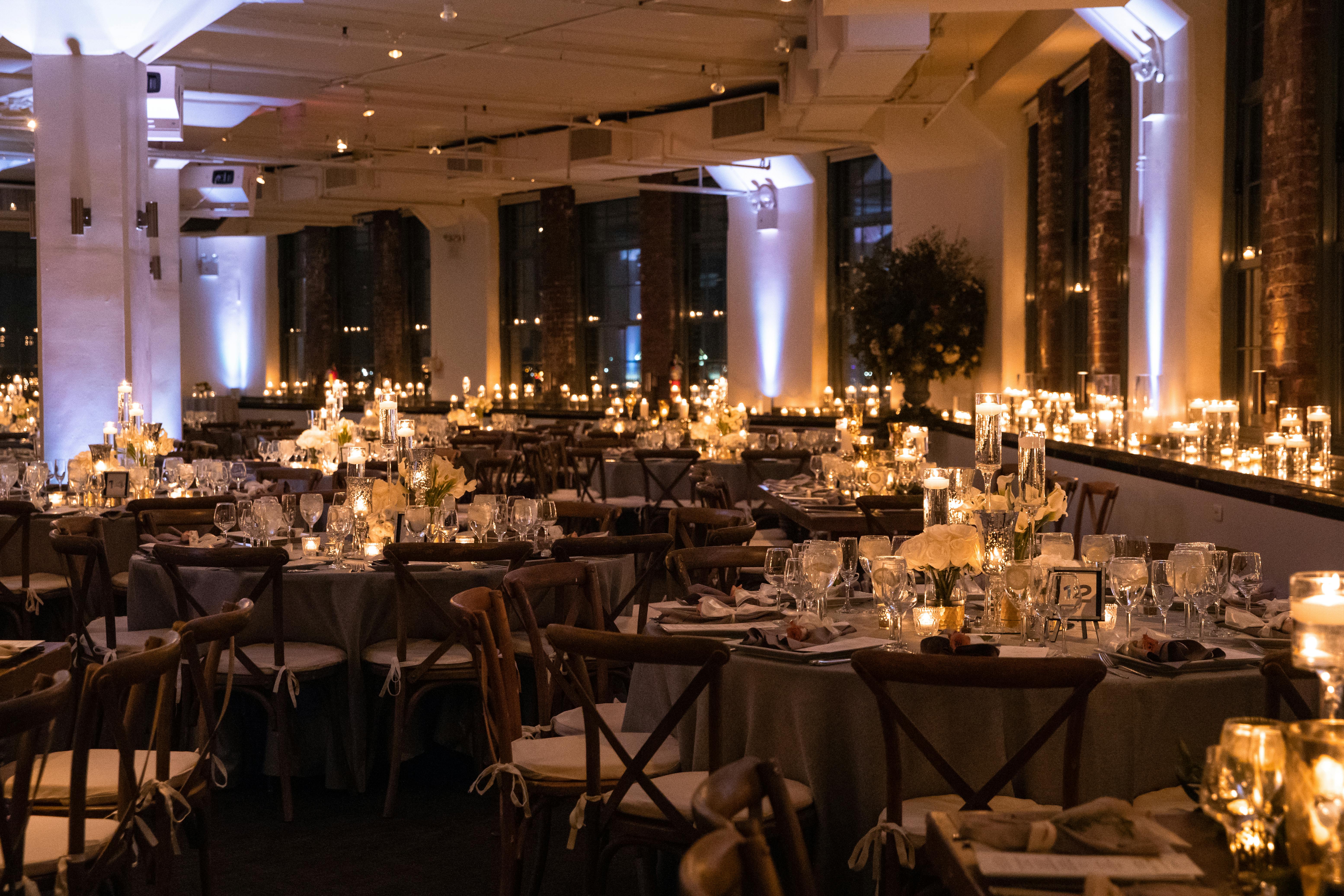 Room filled with tables and candles.