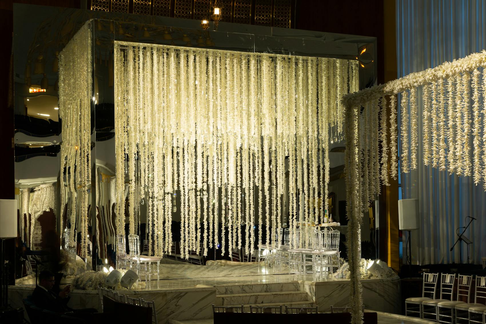 Draped crystals that crown an all-silver lounge area