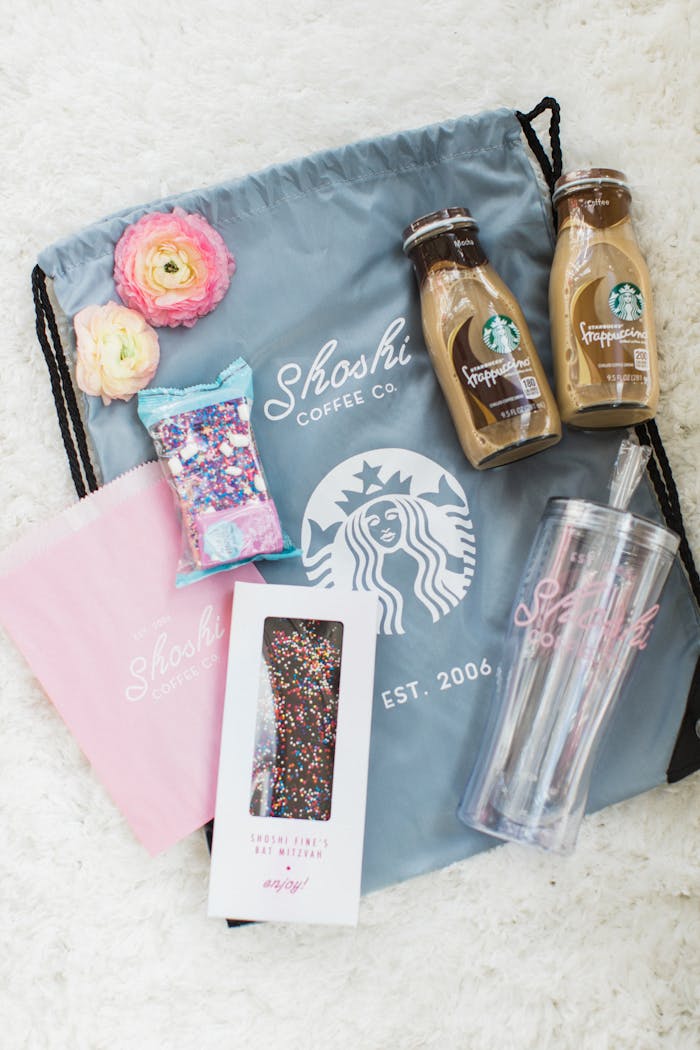 Starbucks themed party gift bags containing coffee goods and treats | PartySlate