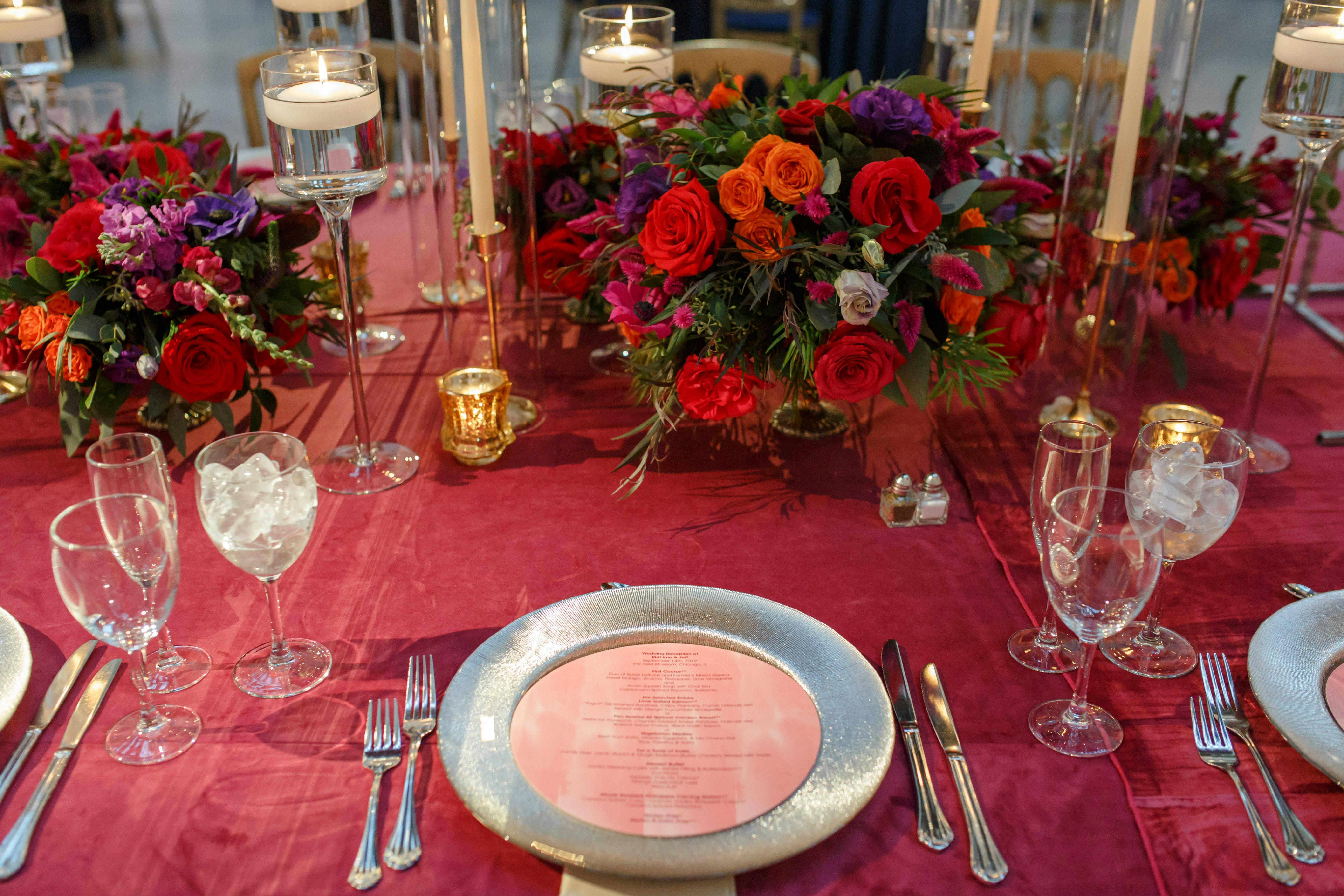 Red tablescape with red linens and red roses. 