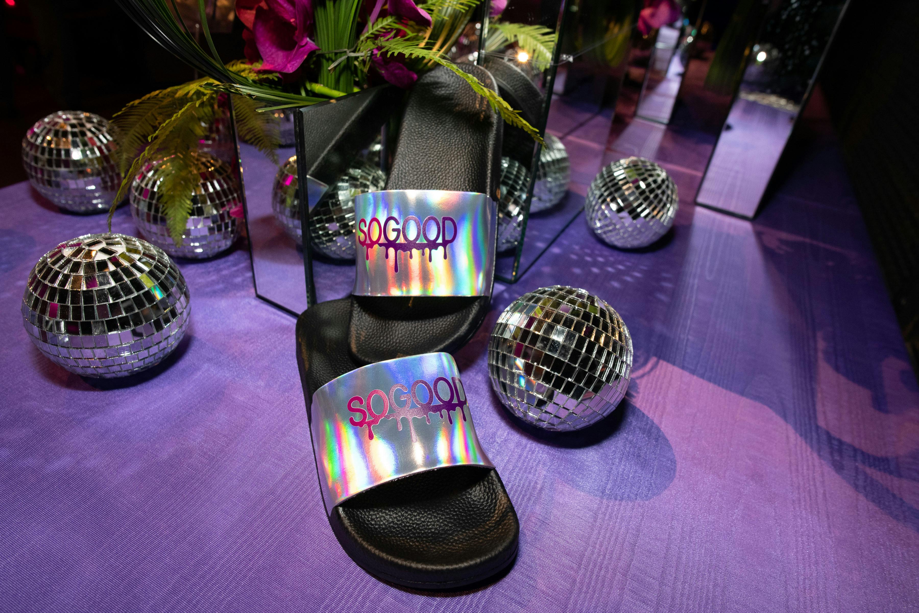 purple floor with close-up of iridescent saddle and glittering-mini disco balls