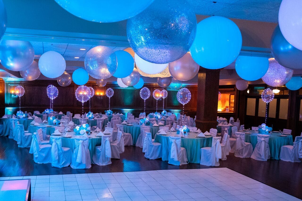 Bat Mitzvah party with LED balloons and teal uplighting